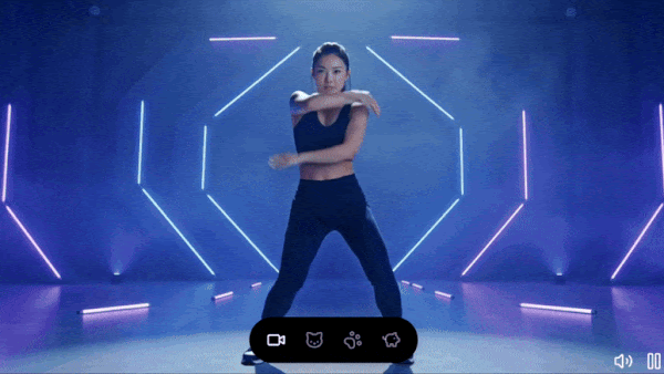 A dancing woman morphs into a black cat, then a monkey, and finally a pig under neon hexagon lights, illustrating xAI’s video generator capabilities.