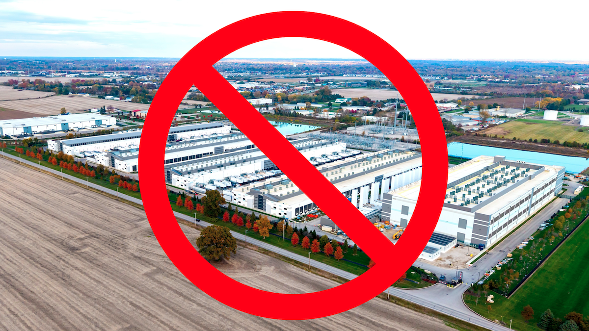 Aerial view of a large data center with a red prohibition sign overlayed, indicating opposition.